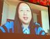 台湾でのデジタルイノベーションについてオンラインで講演するオードリー・タン大臣＝３１日、宜野湾市の沖縄コンベンションセンター