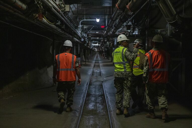 <div class="caption">In October 2022, military personnel walk through the US Navy’s Red Hill Bulk Fuel Storage Facility. (US Army)</div>