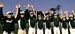 チームの先輩、宮城大弥投手が新人王を獲得した知らせを聞き、バンザイし喜ぶ中学硬式野球チーム「宜野湾ポニーズ」のメンバーら＝１５日、宜野湾市内
