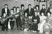 奄美出身者の集まりで、後の「フィンガー５」の（前列左端から）３人と写真に収まる中学生の宮永英一さん（後列右端）。いずれもギターを持っている（宮永さん提供）