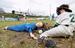 　田んぼの本塁上でクロスプレーを演じる走者と捕手のかかし＝２２日、福岡県飯塚市